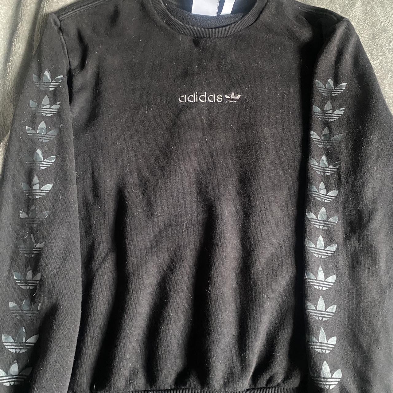 black adidas jumper with logo on the sleeves. size... - Depop