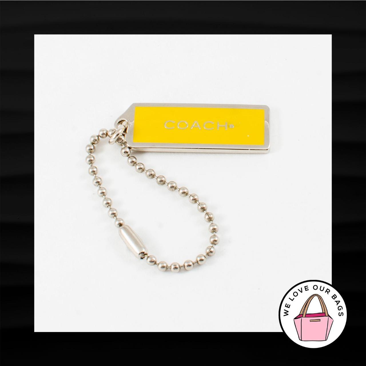 Coach gold clearance metal hang tag