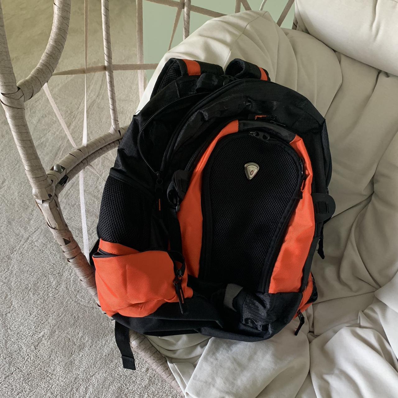 Black and orange backpack with lots of pockets . Depop