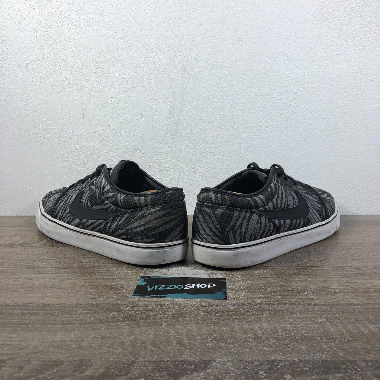 nike toki low all black