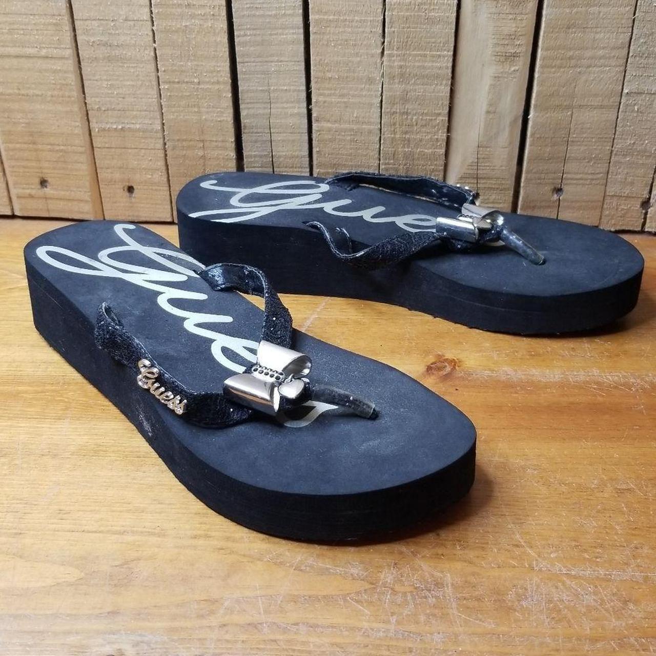 Guess black flip outlet flops with bow