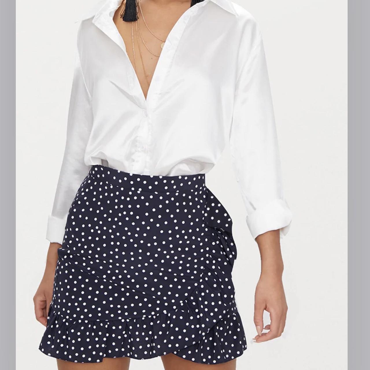 PrettyLittleThing navy polka dot frill hem wrap mini