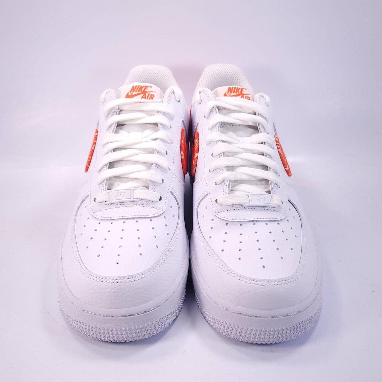 Nike Air Force 1 '07 ESS sneakers in white and orange