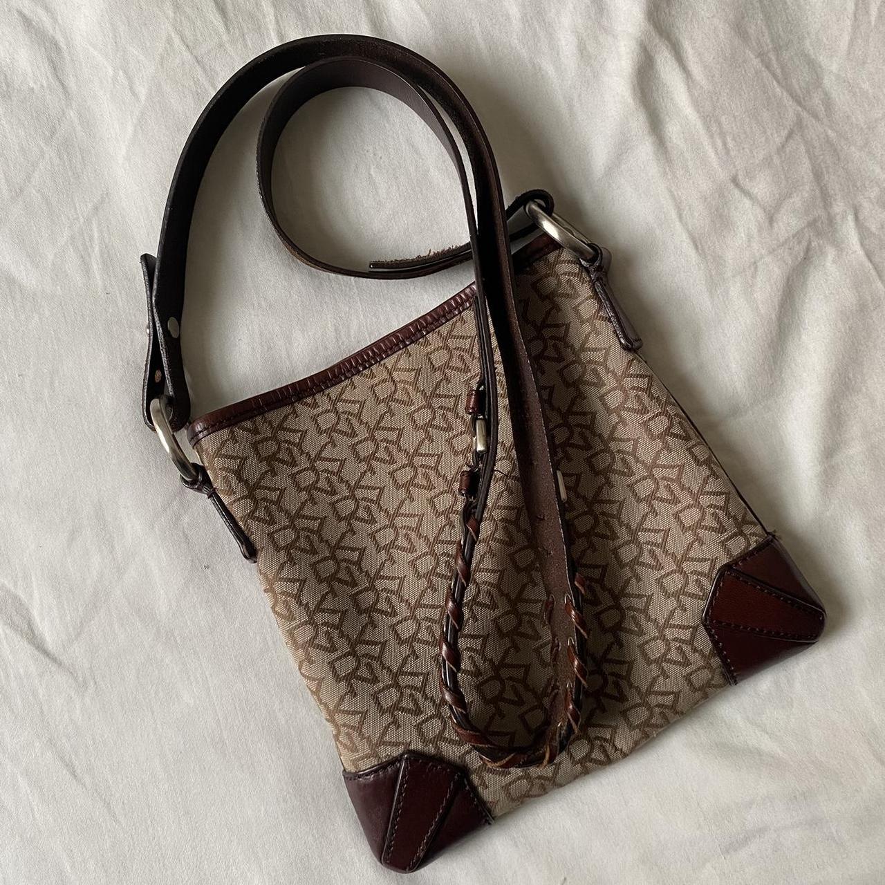 DKNY cross body bag with leather strap and monogram... Depop
