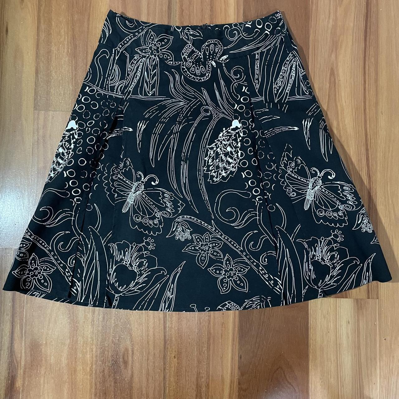 Black midi skirt with unique white floral like... - Depop