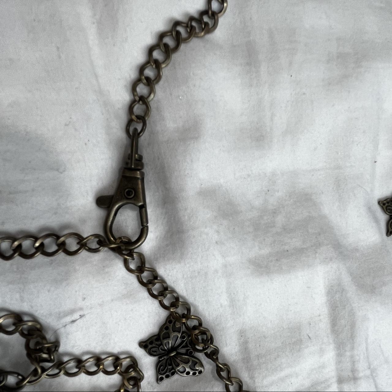 Black wash gold butterfly chain belt from urban... Depop
