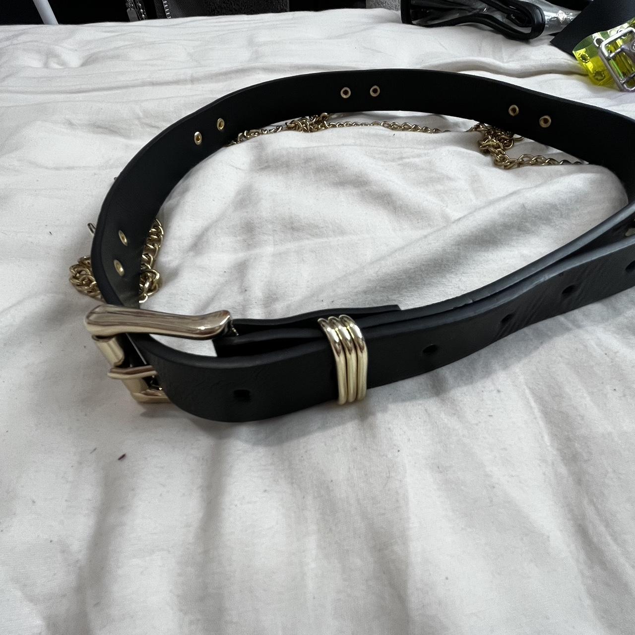 Black and gold belt with gold chain hanging details... Depop