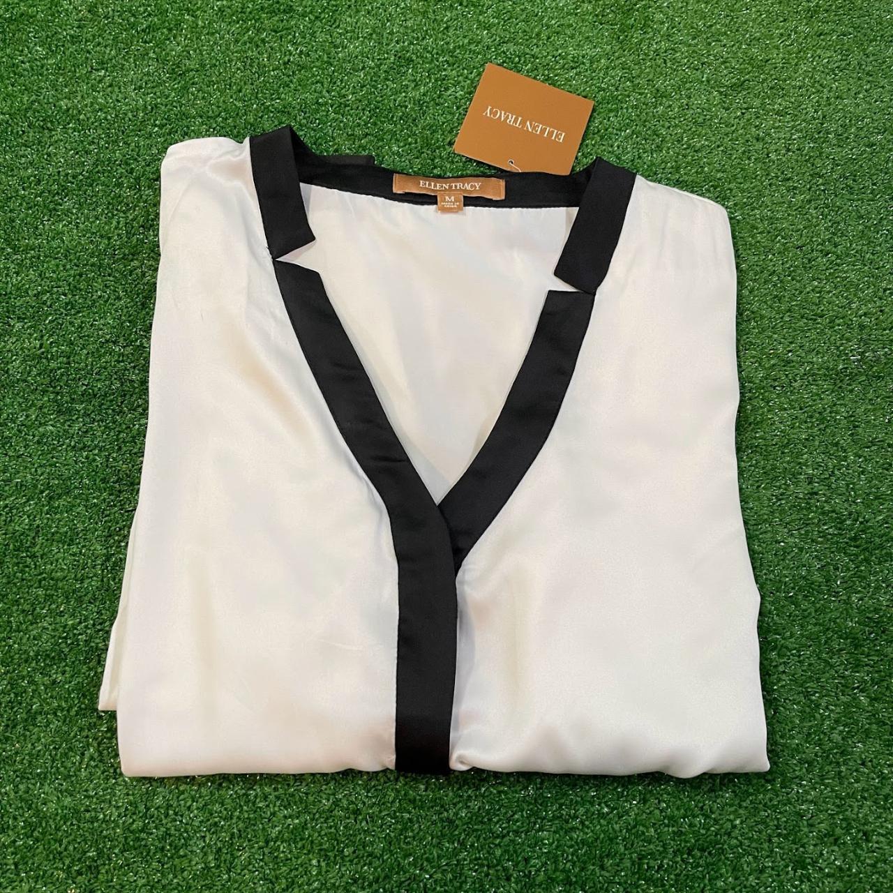 cream blouse with black trim