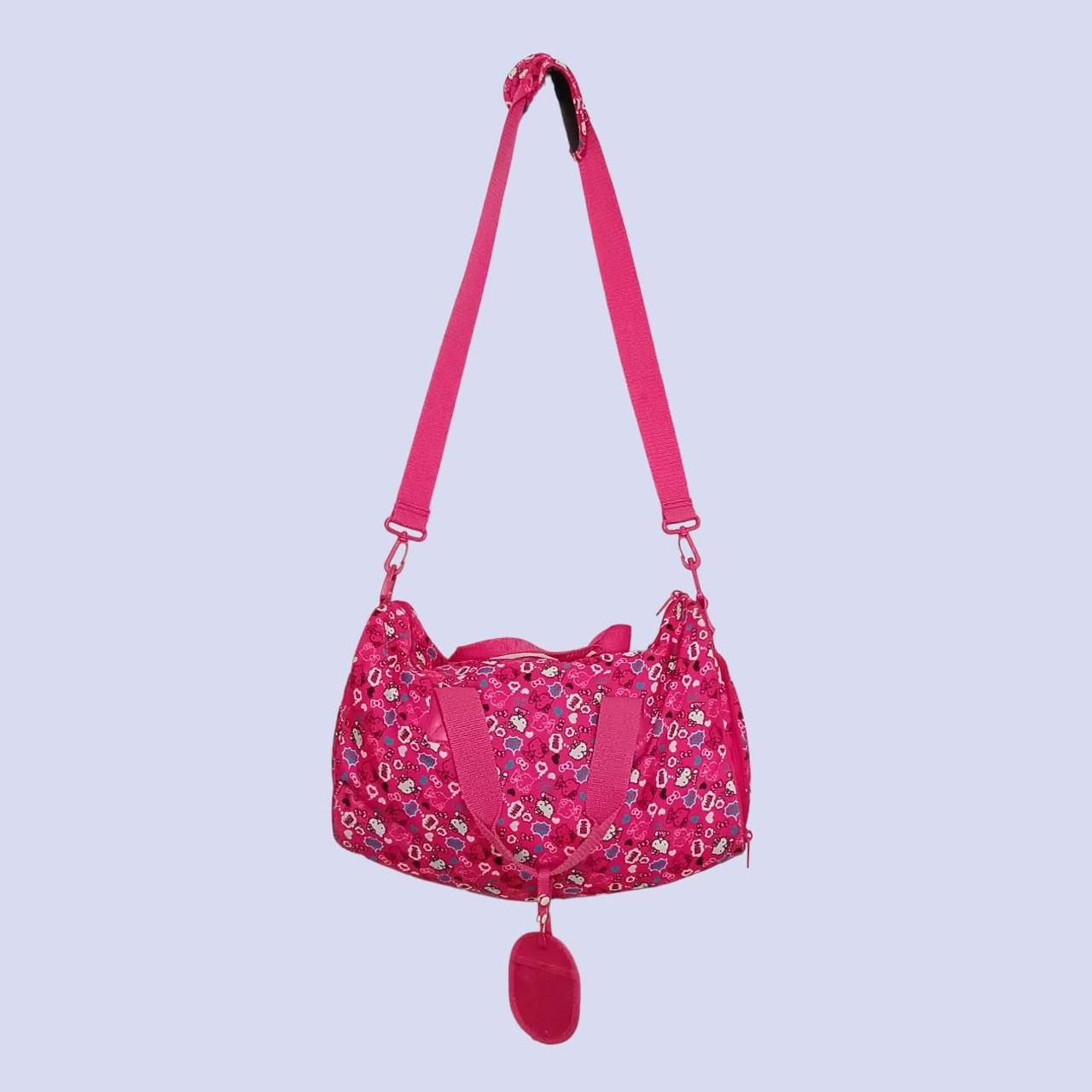Hello Kitty pink travel bag with adjustable... Depop