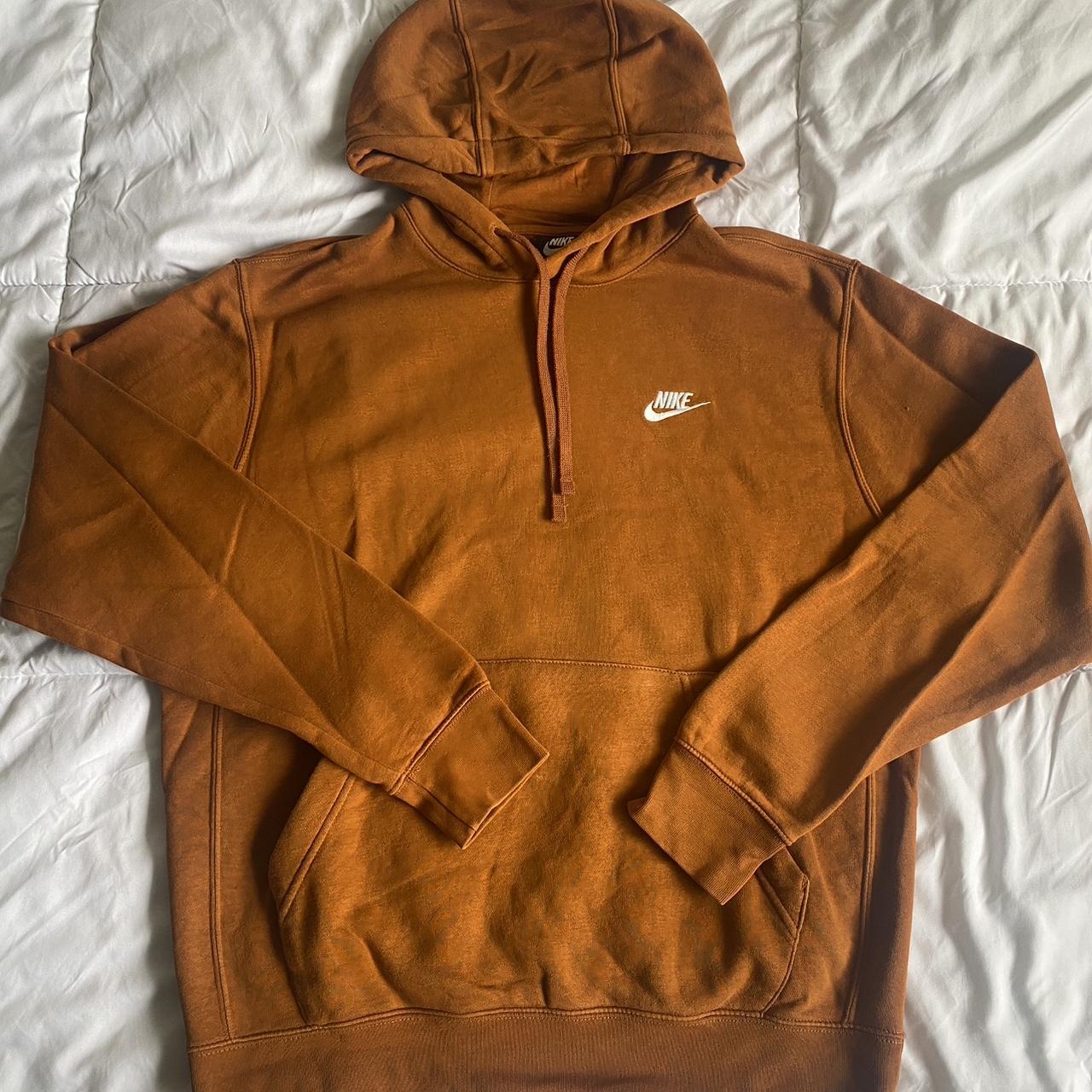 white nike hoodie with orange logo