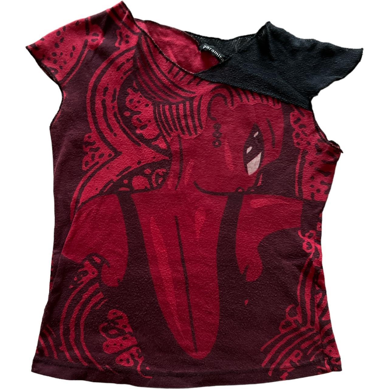 woman print graphic top labelled as size Medium,... Depop