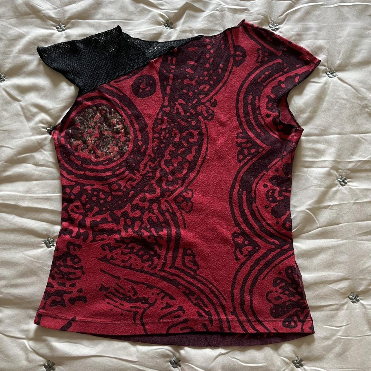 woman print graphic top labelled as size Medium,... Depop