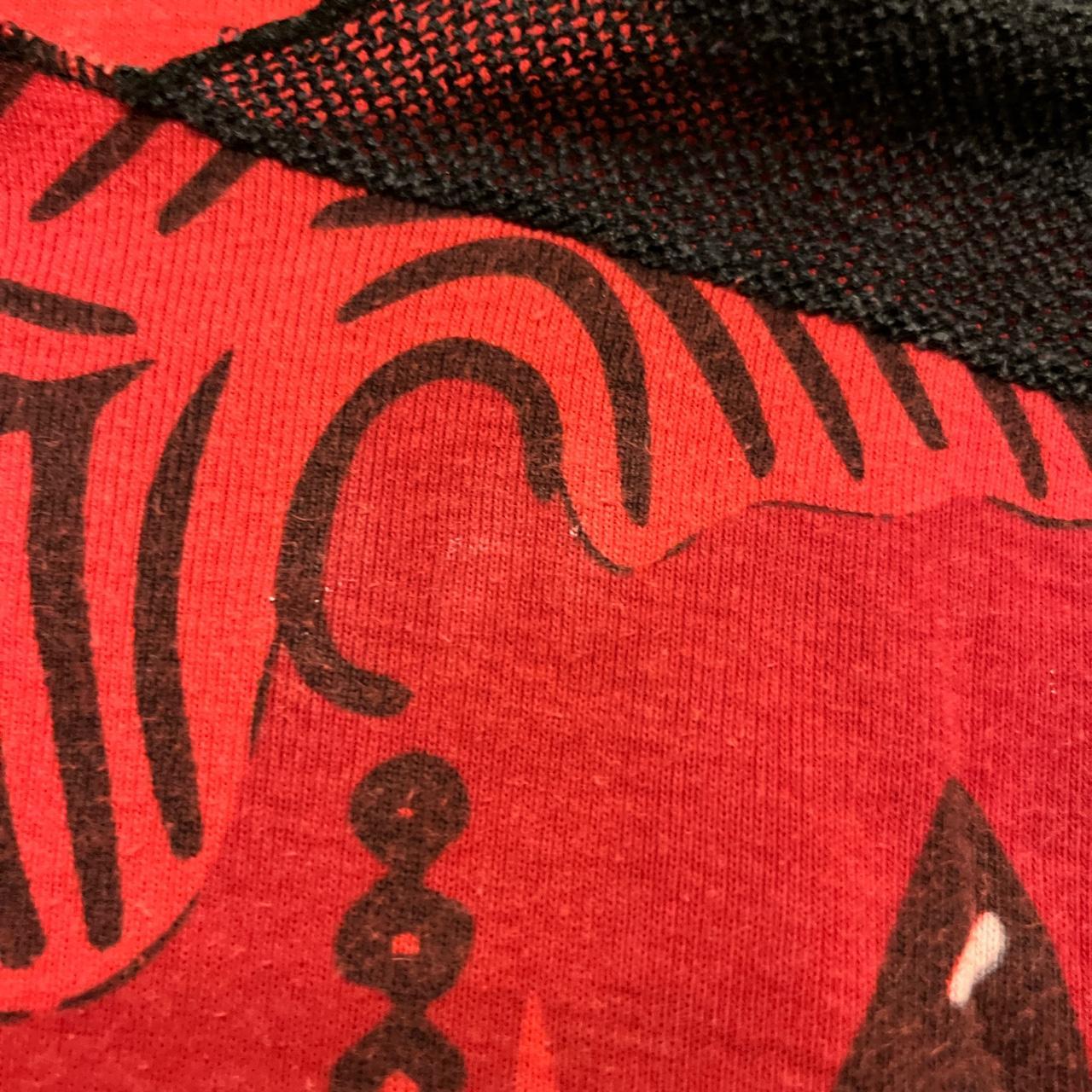 woman print graphic top labelled as size Medium,... Depop