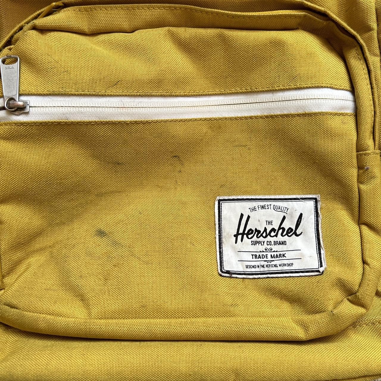 Herschel Yellow Backpack decent wear, marks on... Depop
