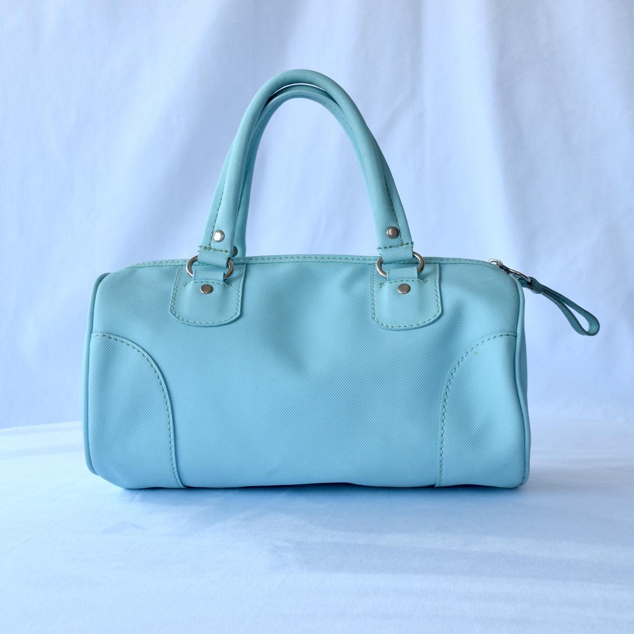 Chic Lacoste Light Blue Cylinder Handbag - Trendy... - Depop