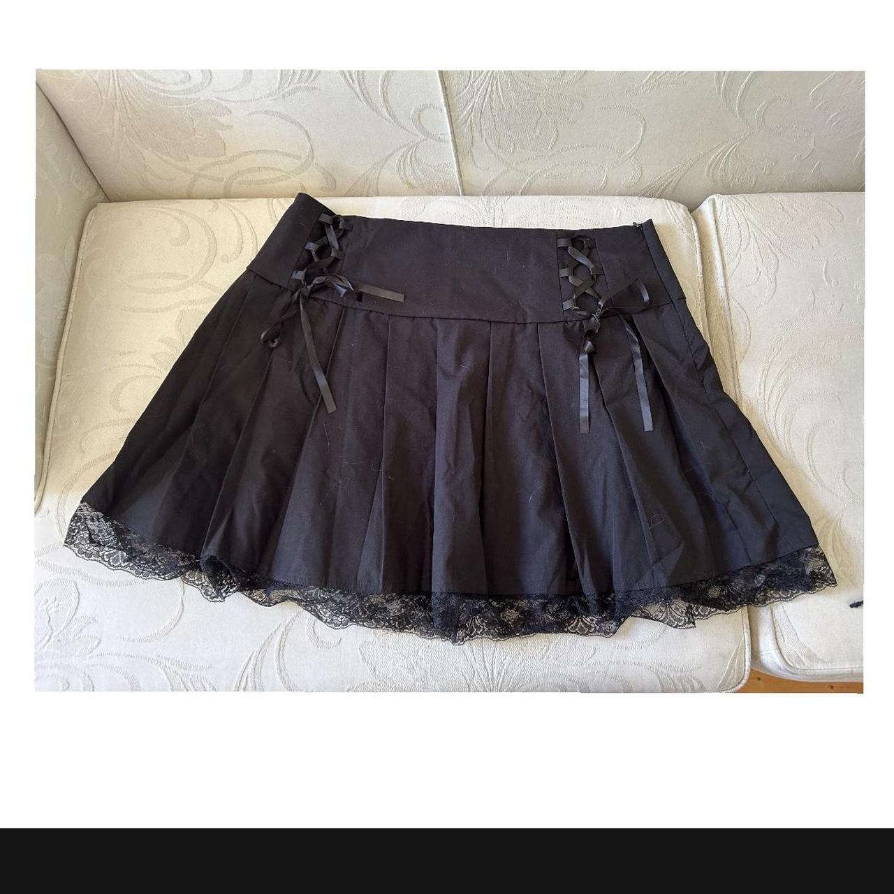 Repop: black pleated skirt Has cute little tie up... - Depop