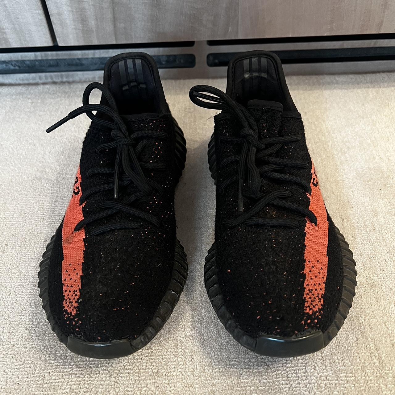 Black Yeezys with red stripe in size 38. Limited... - Depop