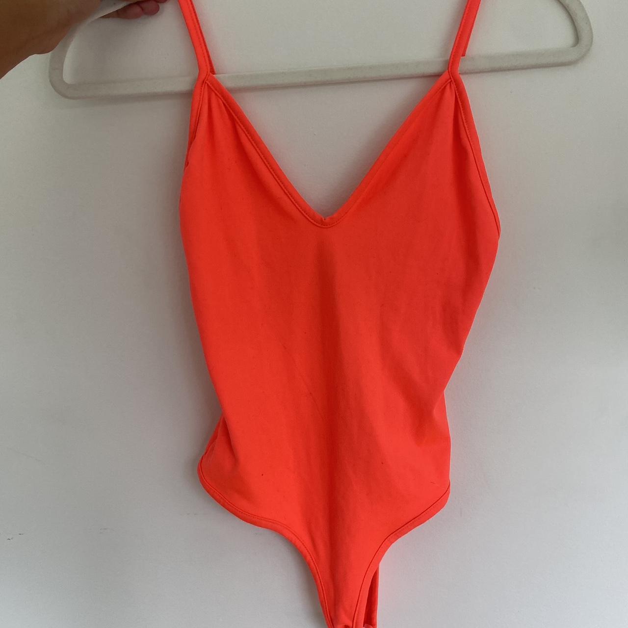 super cute neon orange body suit. the fabric is... - Depop