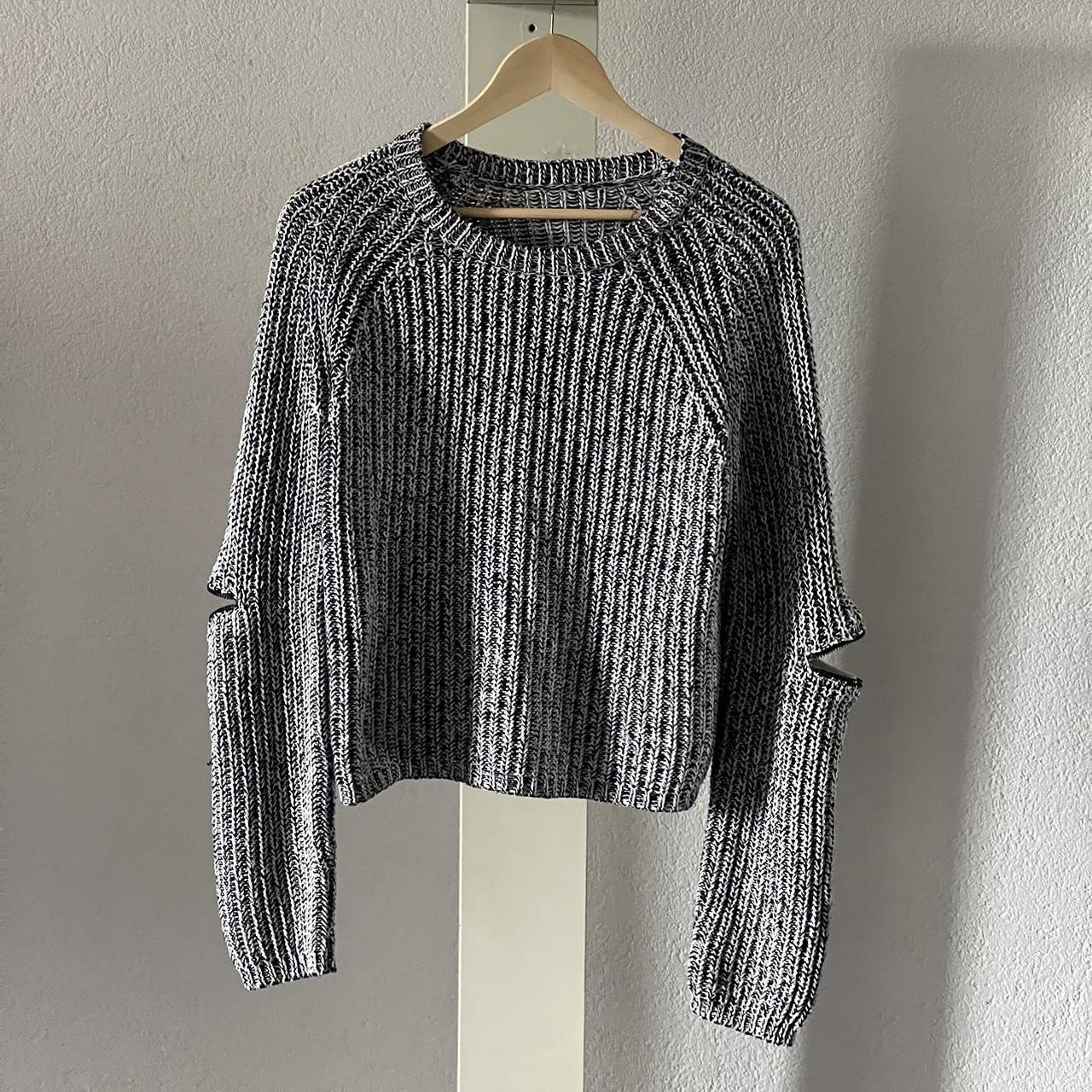 Archive Style knit sweater with zips on the elbows,