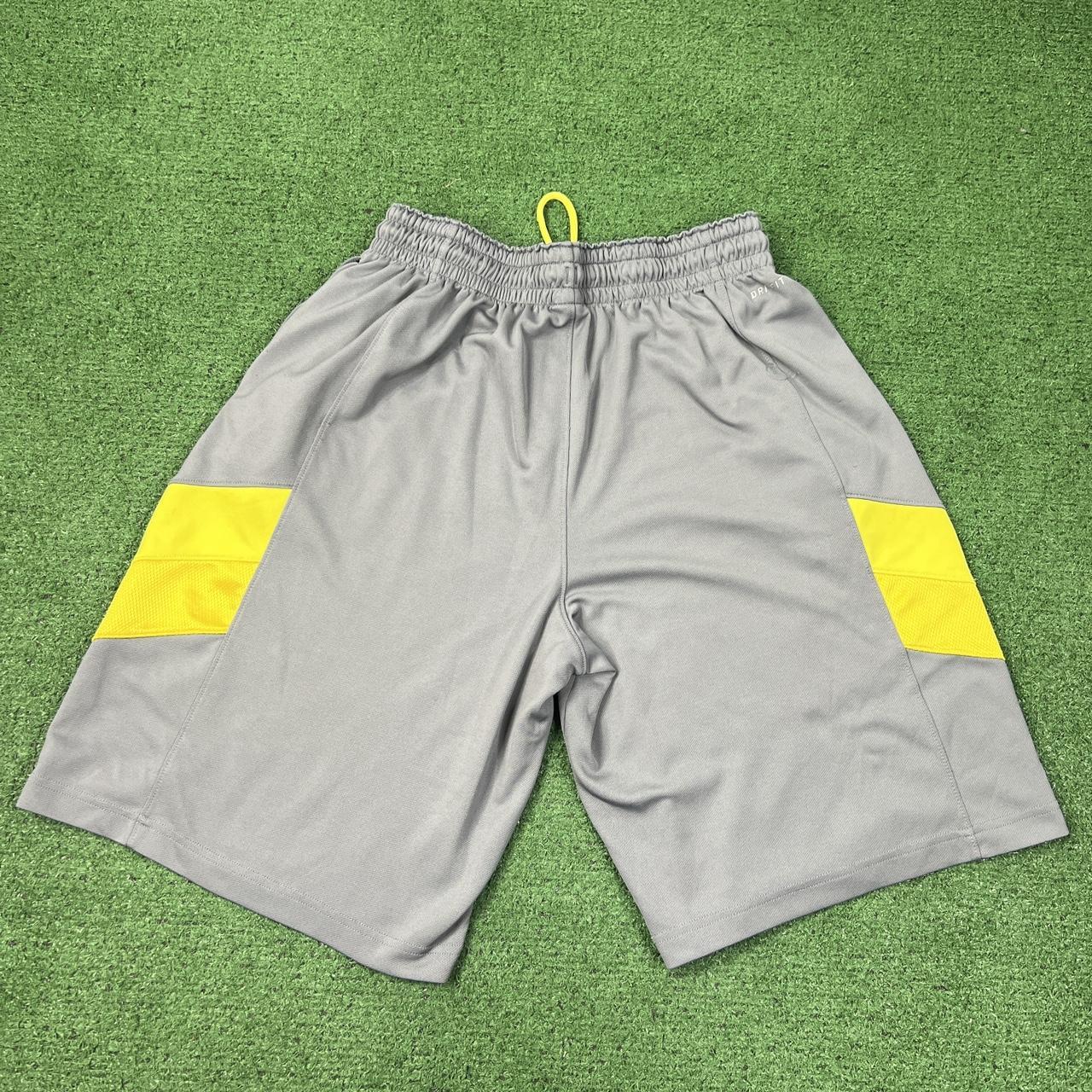 Green red best sale yellow nike shorts