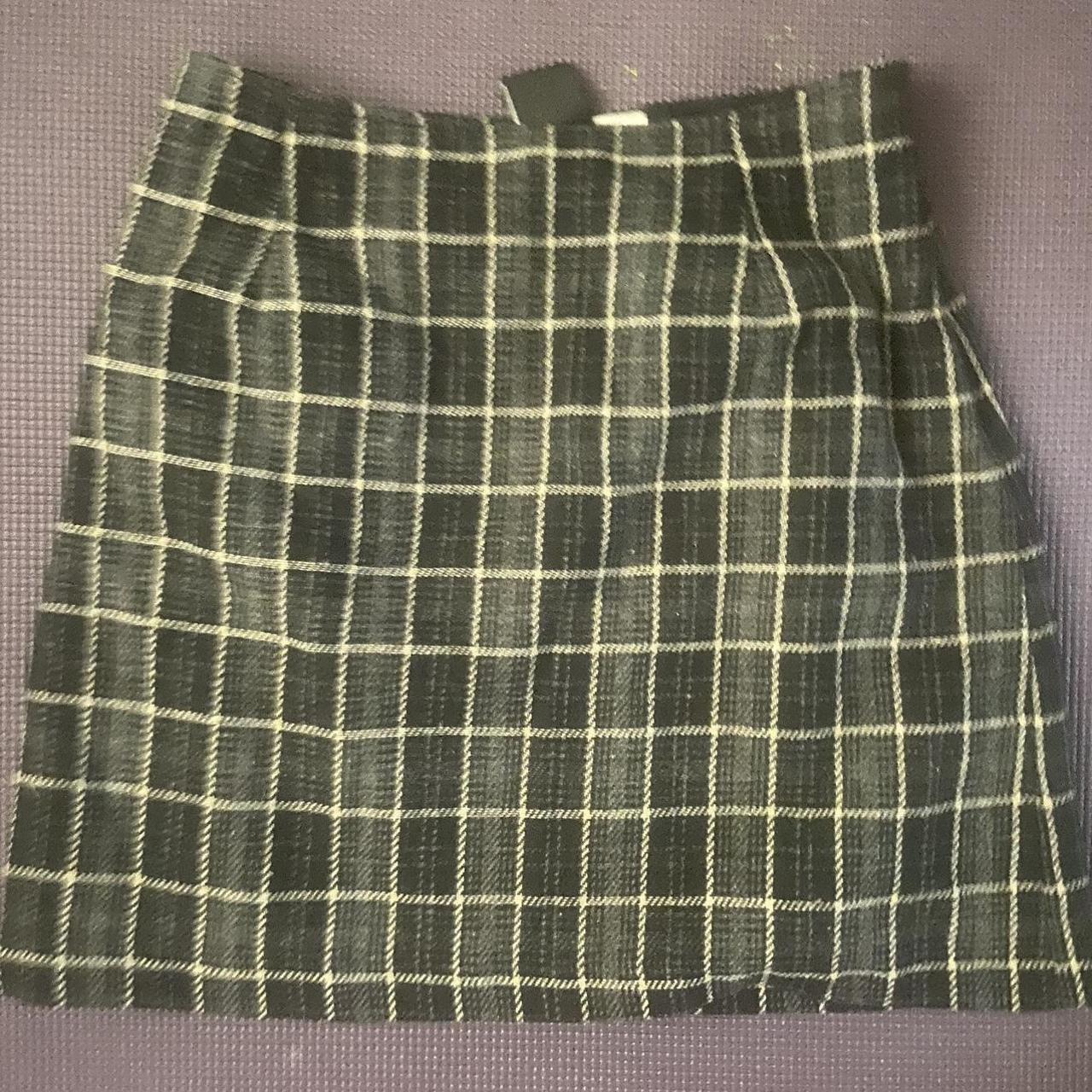 Wool plaid skirt, greenish undertone. Size 6. It has... - Depop