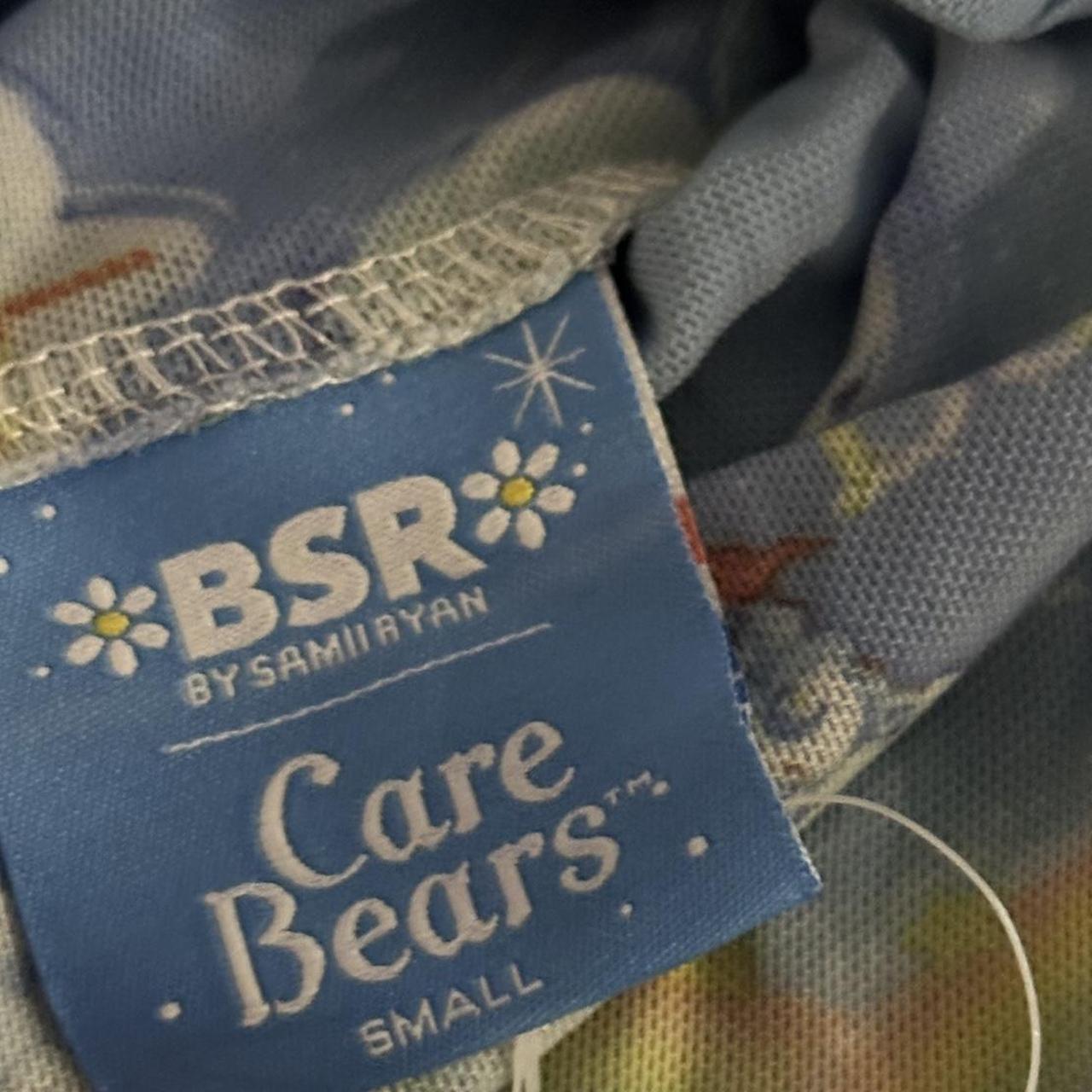 Blue Care Bears onesie with rainbow and clouds... Depop