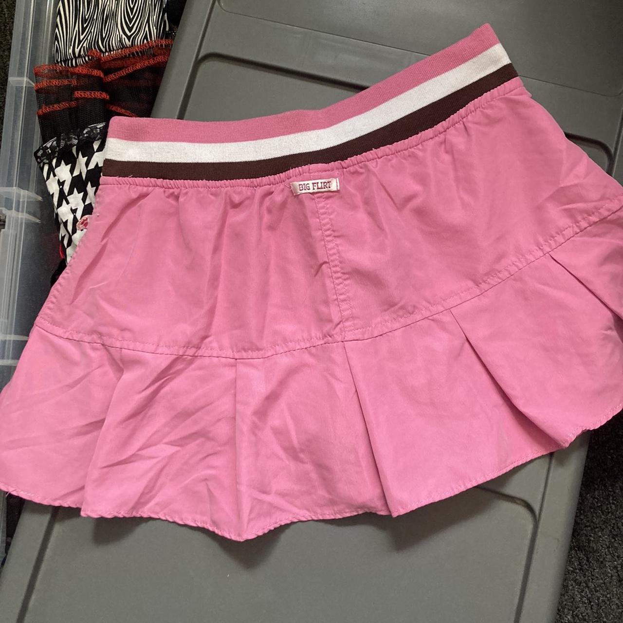 Big flirt pleated pink skirt. Has a brown and white... - Depop