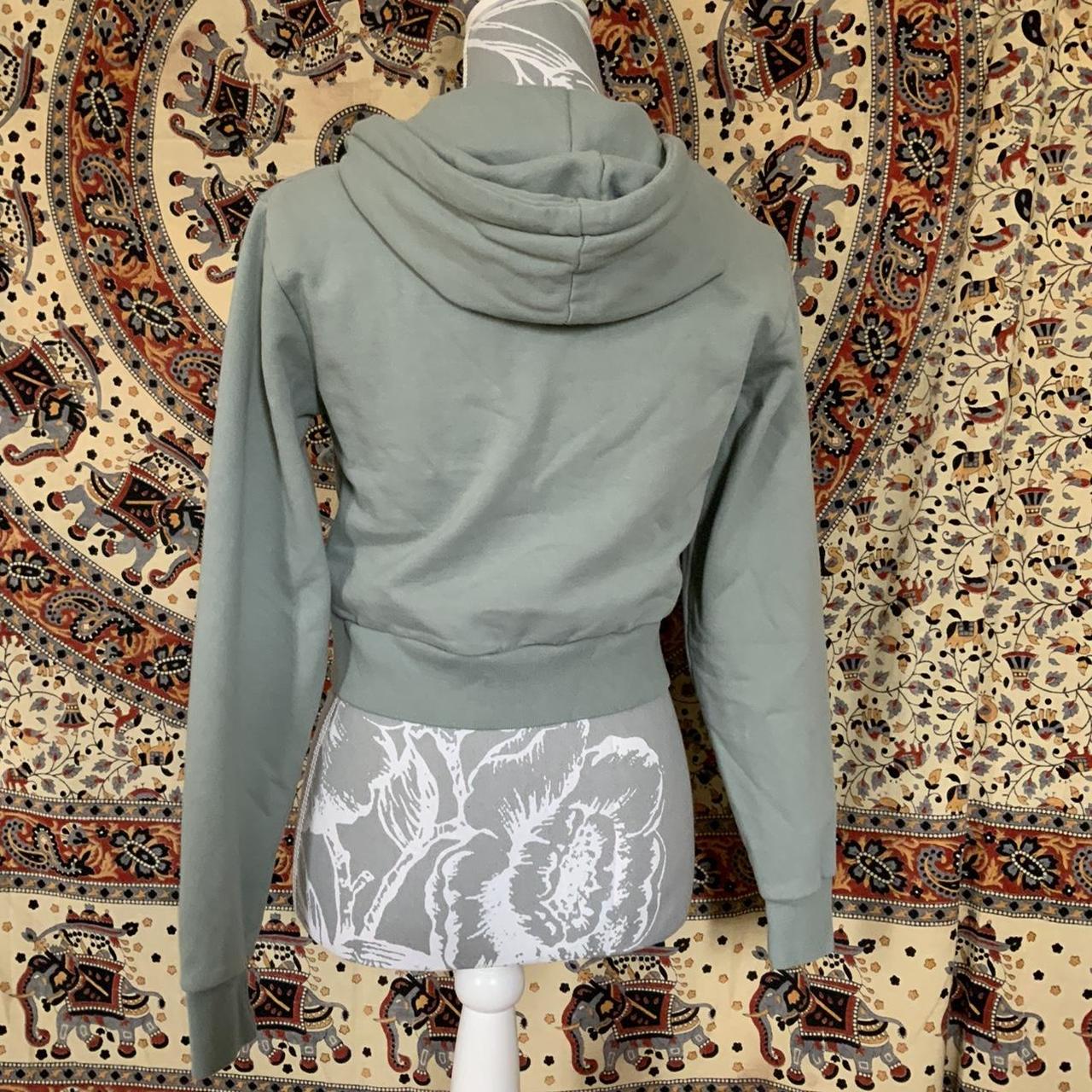 Brandy Melville green zip up hoodie Size small... Depop