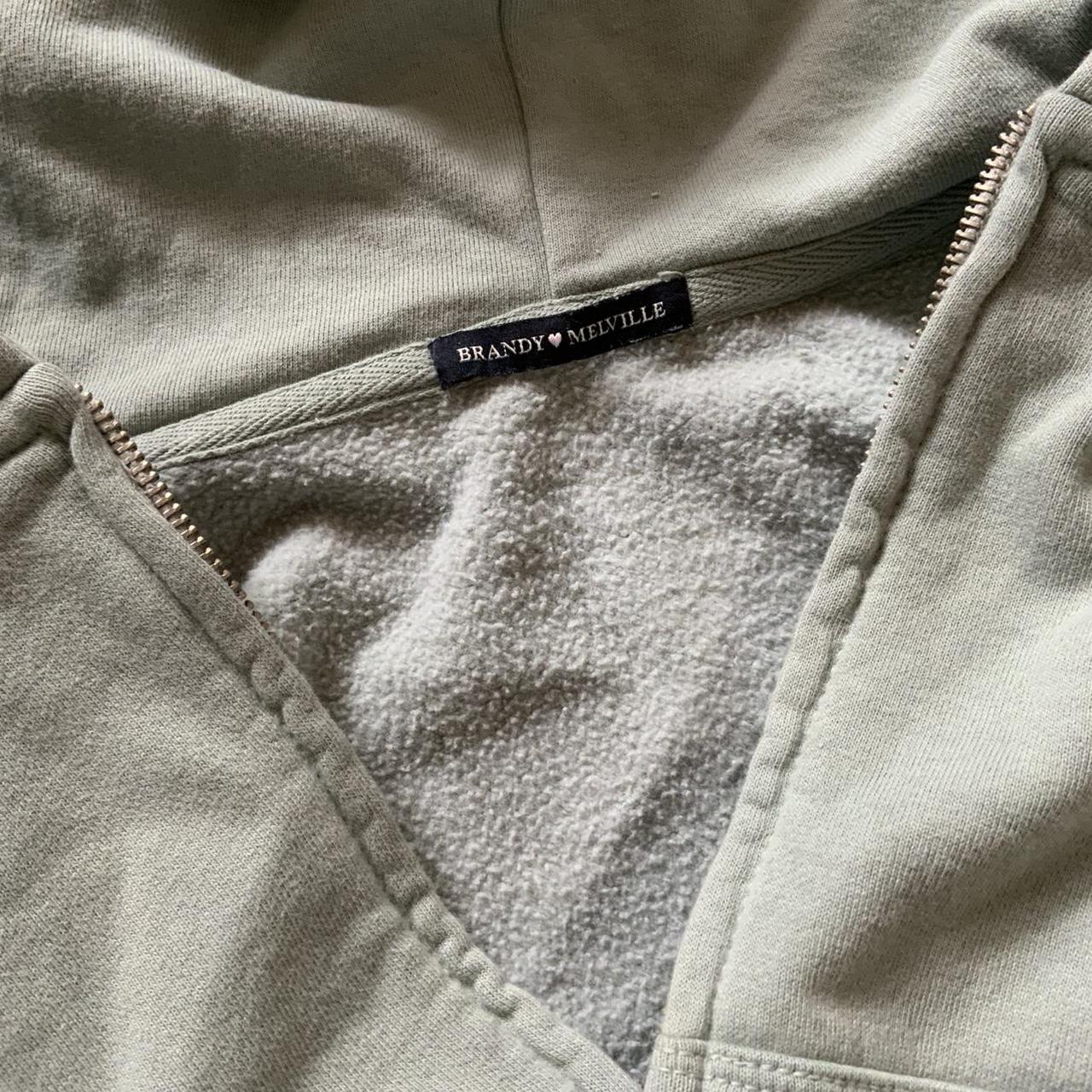 Brandy Melville green zip up hoodie Size - small... - Depop