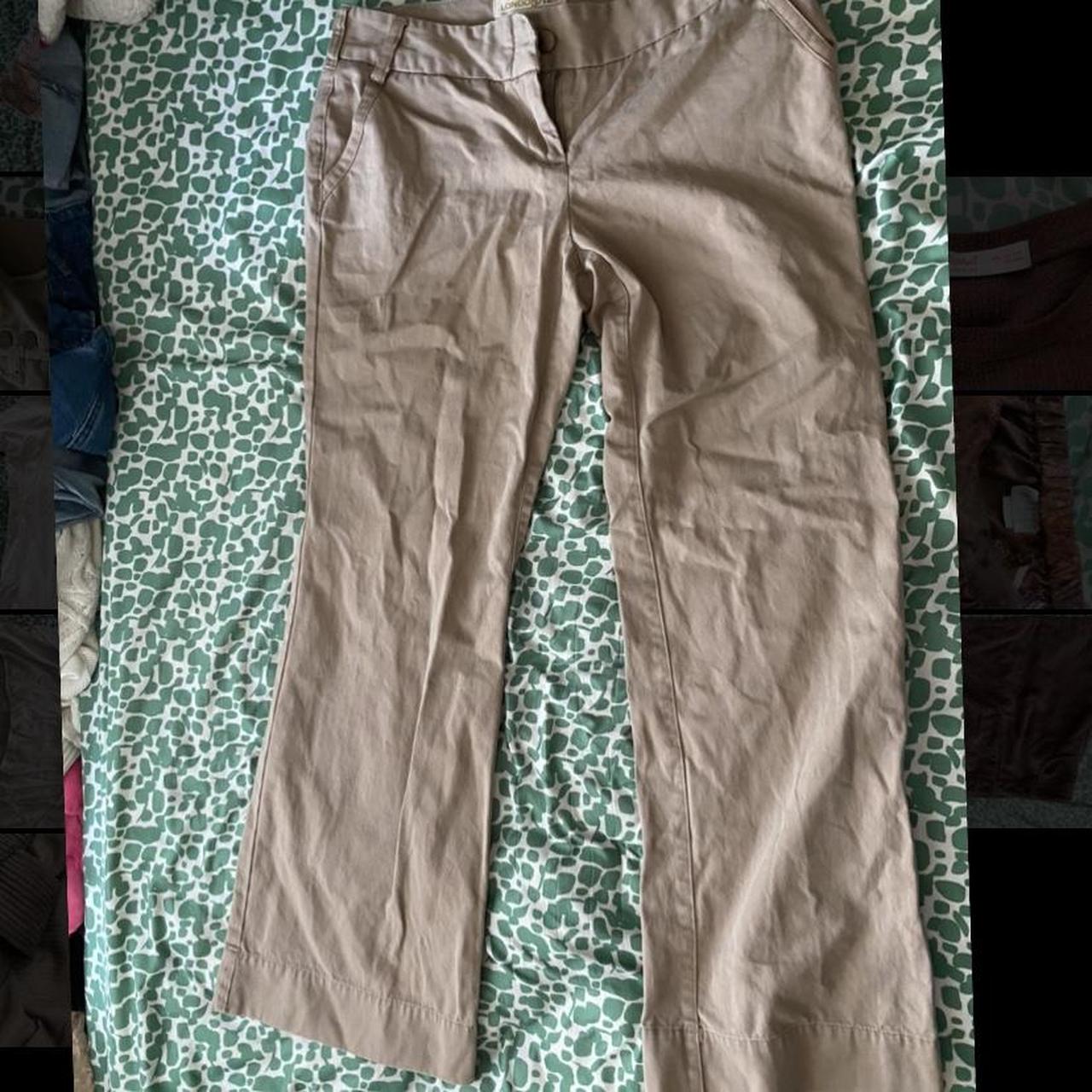 tan pants kind of flared at bottom, not completely... - Depop