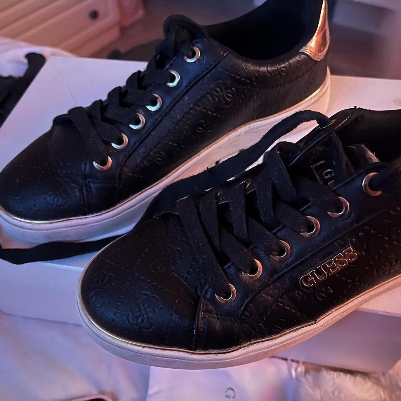 Guess black clearance and gold trainers