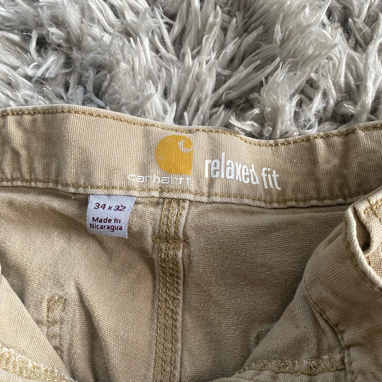 Khaki color mens Carhartt pants.