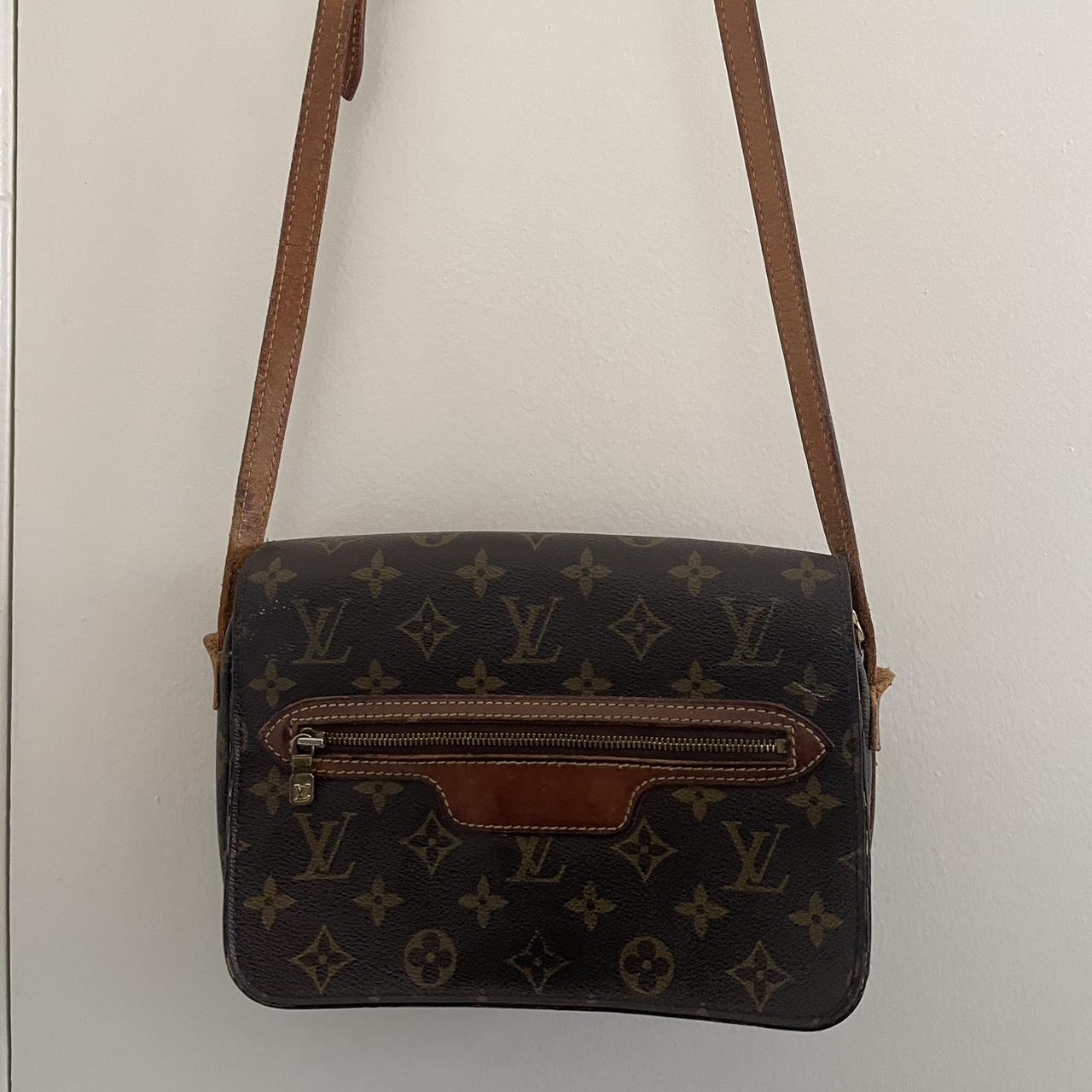 Louis Vuitton crossbody. Zipper opens but is sticky... - Depop