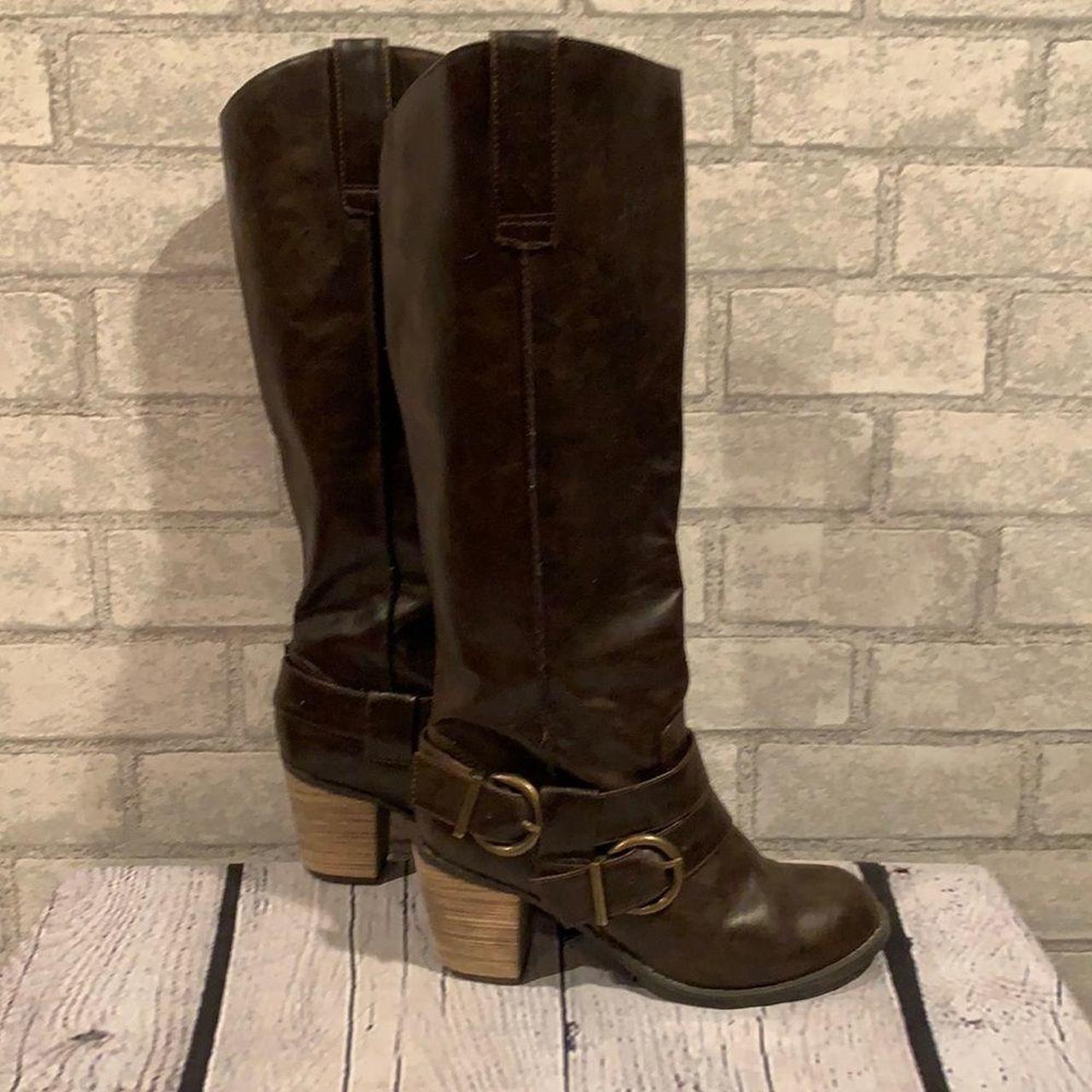 These tall chocolate colored boots by Diba feature a... Depop