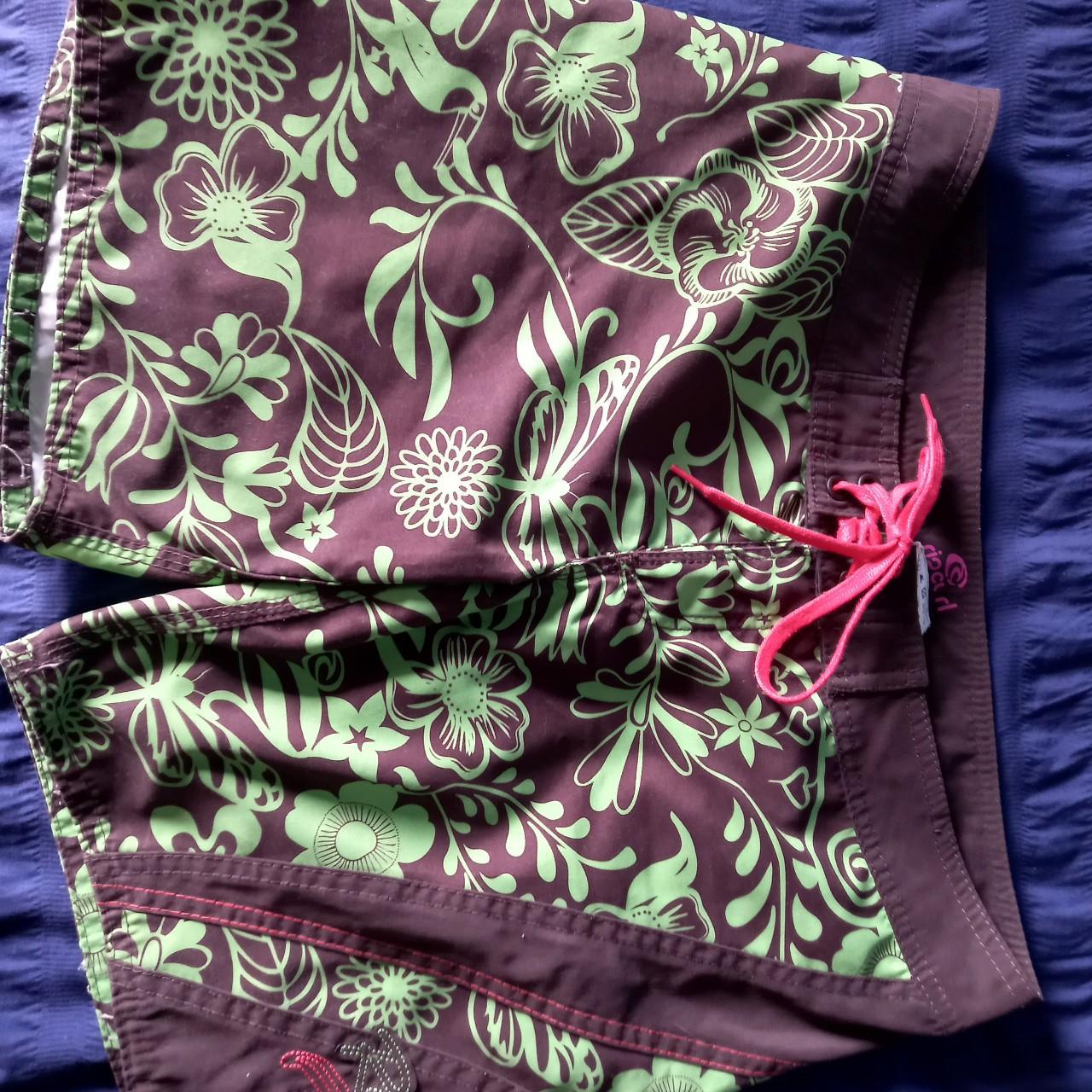 Brown and lime green board shorts from Rip Curl,... Depop