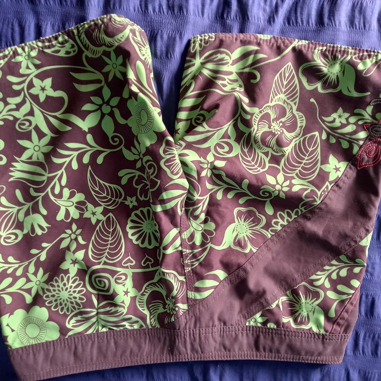 Brown and lime green board shorts from Rip Curl,... Depop