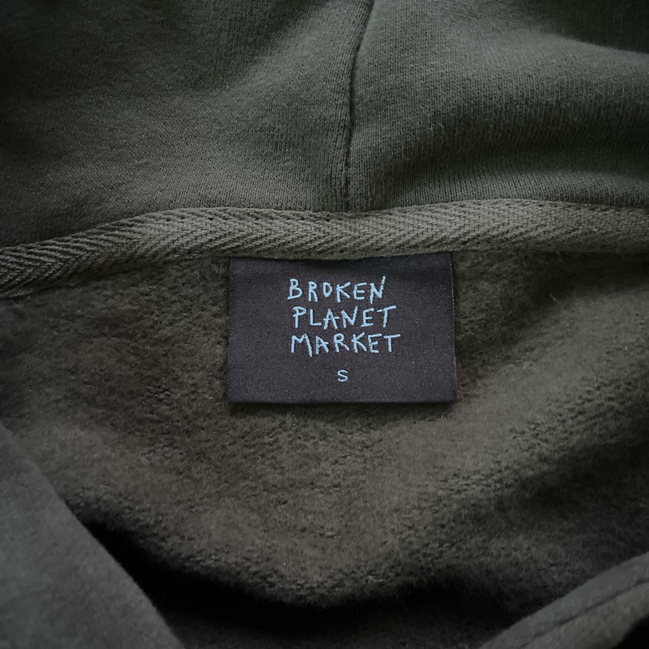 broken planet market hoodie out of sight... - Depop