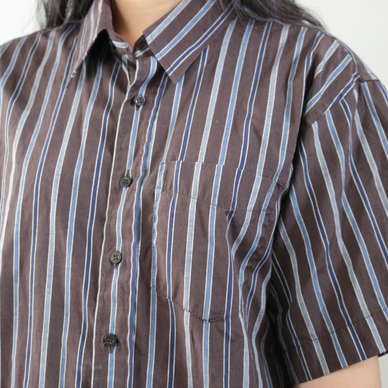 Brown and blue striped shirt. Brand is NSI. Marked a... Depop