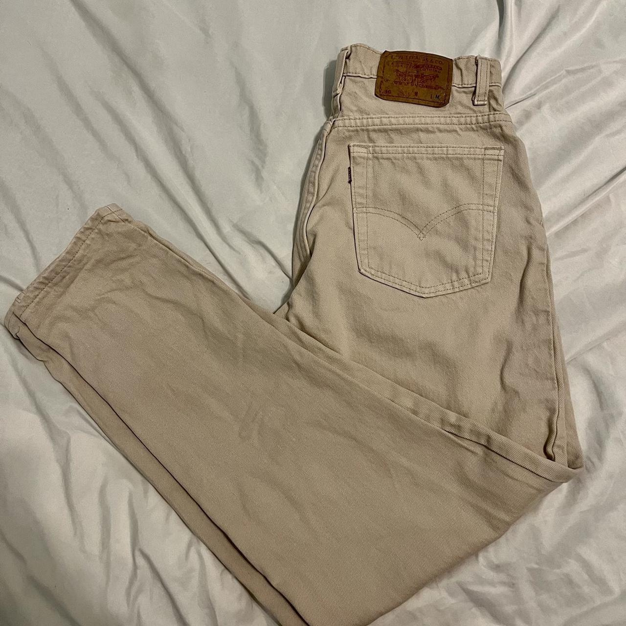 Tan Levi mom jeans size 12 the only stain is in the... - Depop