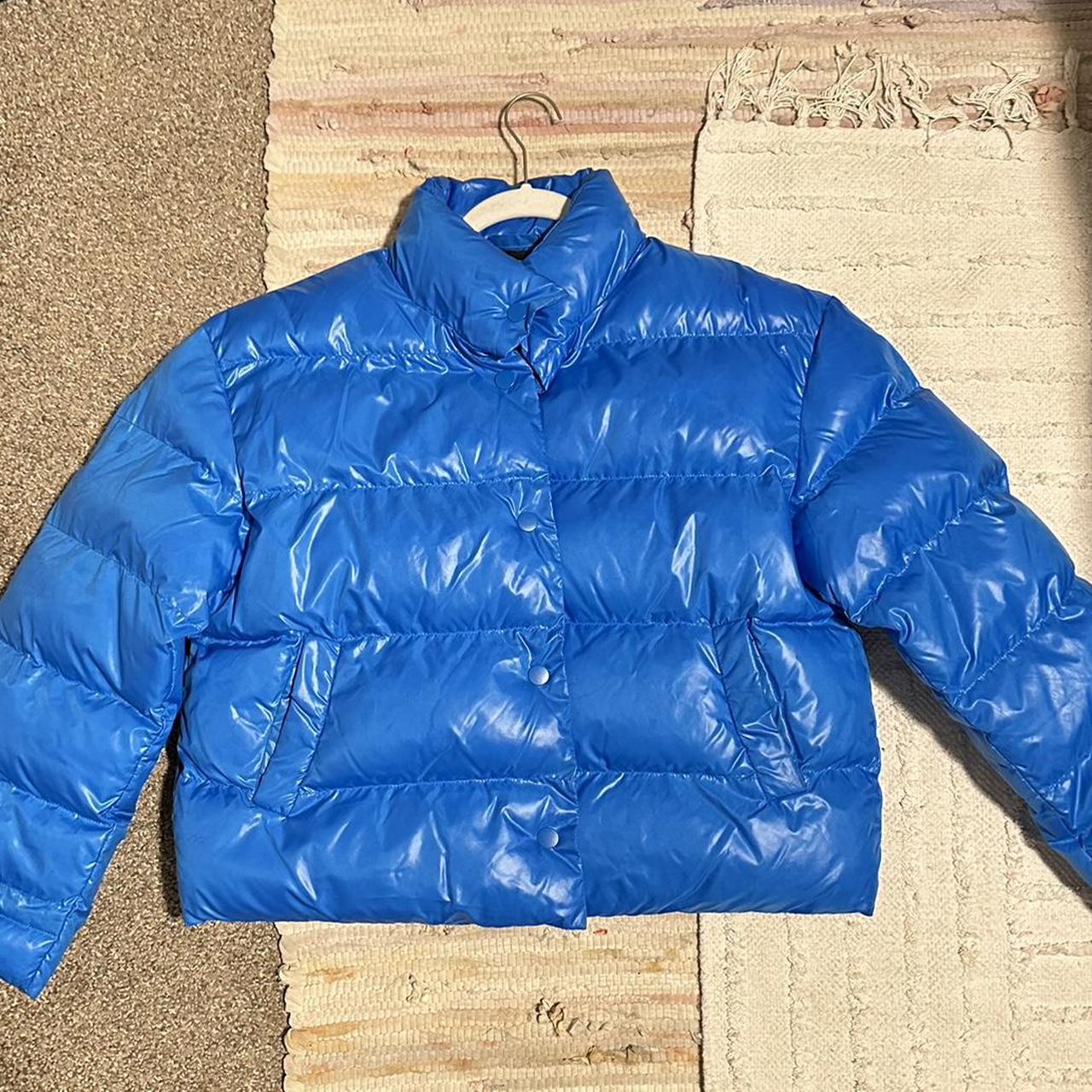 Future Collective bright blue puffer jacket keeps... Depop