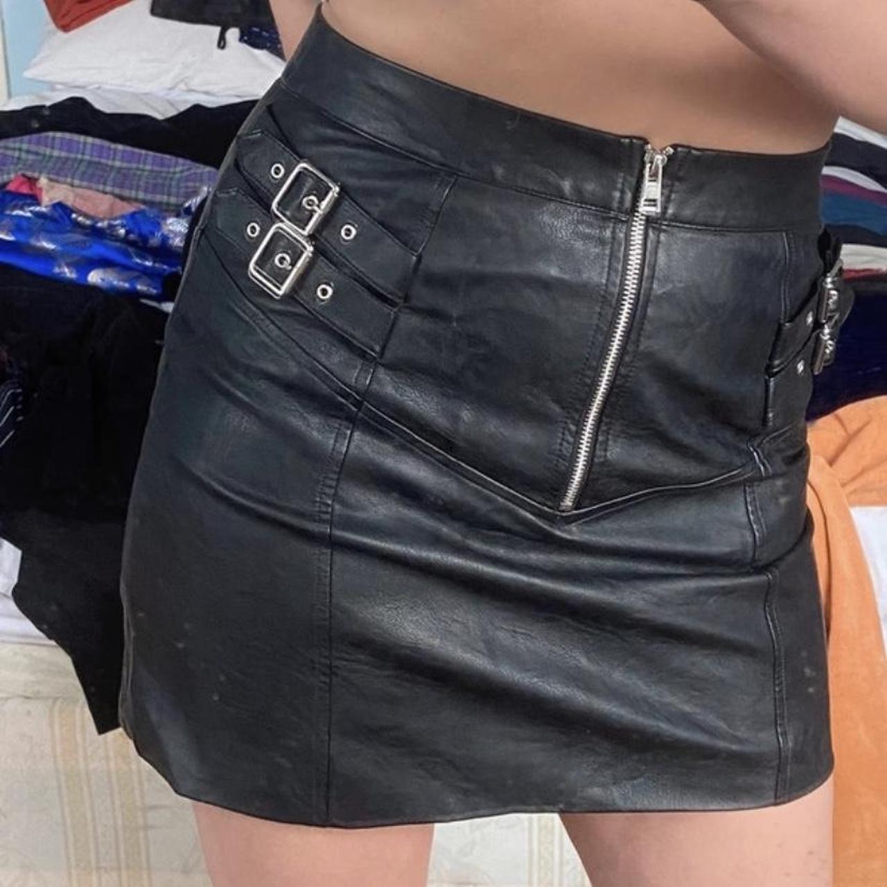 Faux leather mini skirt with buckle and zip details,... - Depop