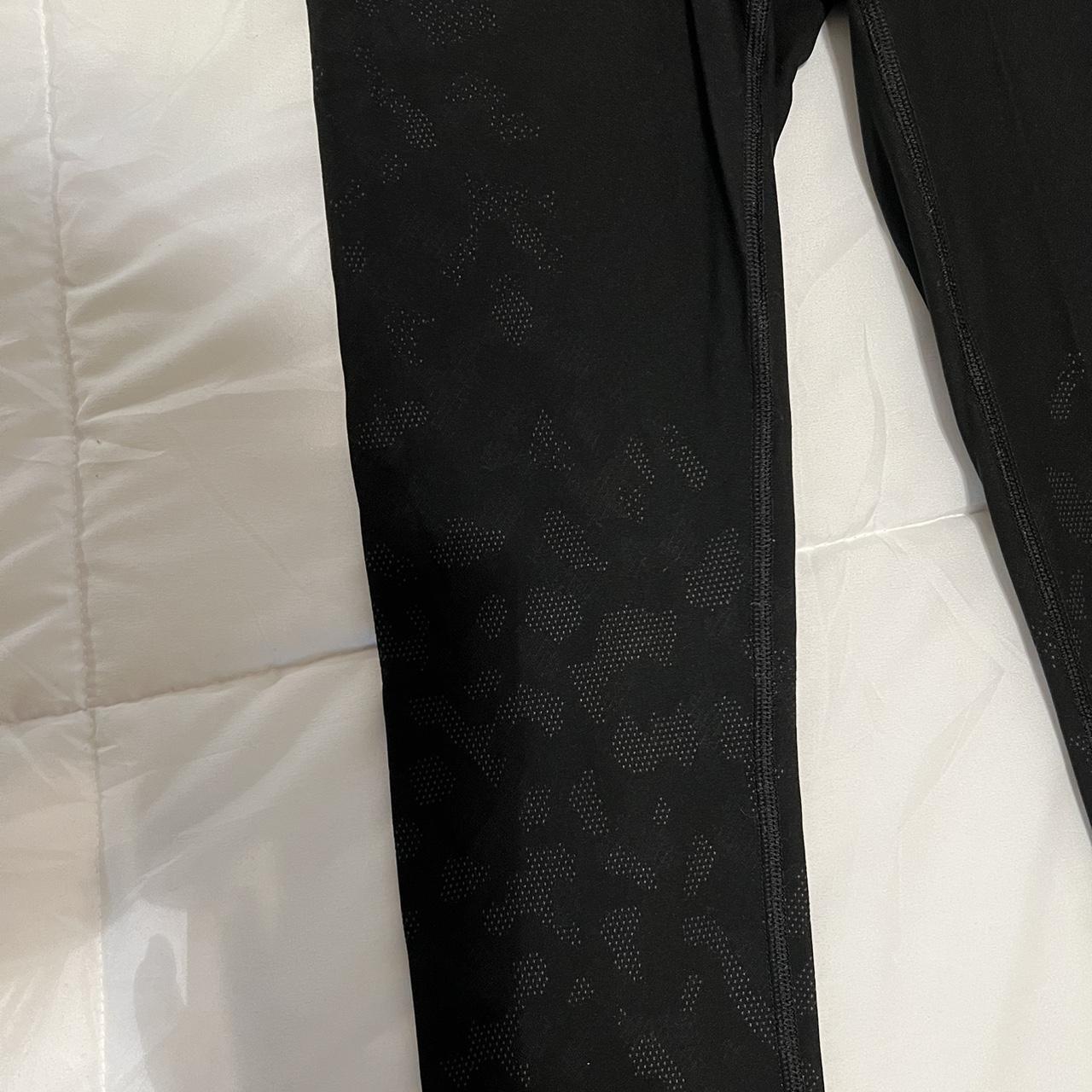 Black Lululemon leggings with a white cheetah type... - Depop