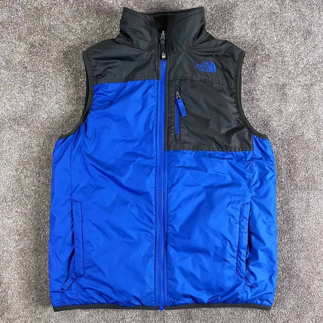 The North Face reversible puffer vest. Men's size... Depop
