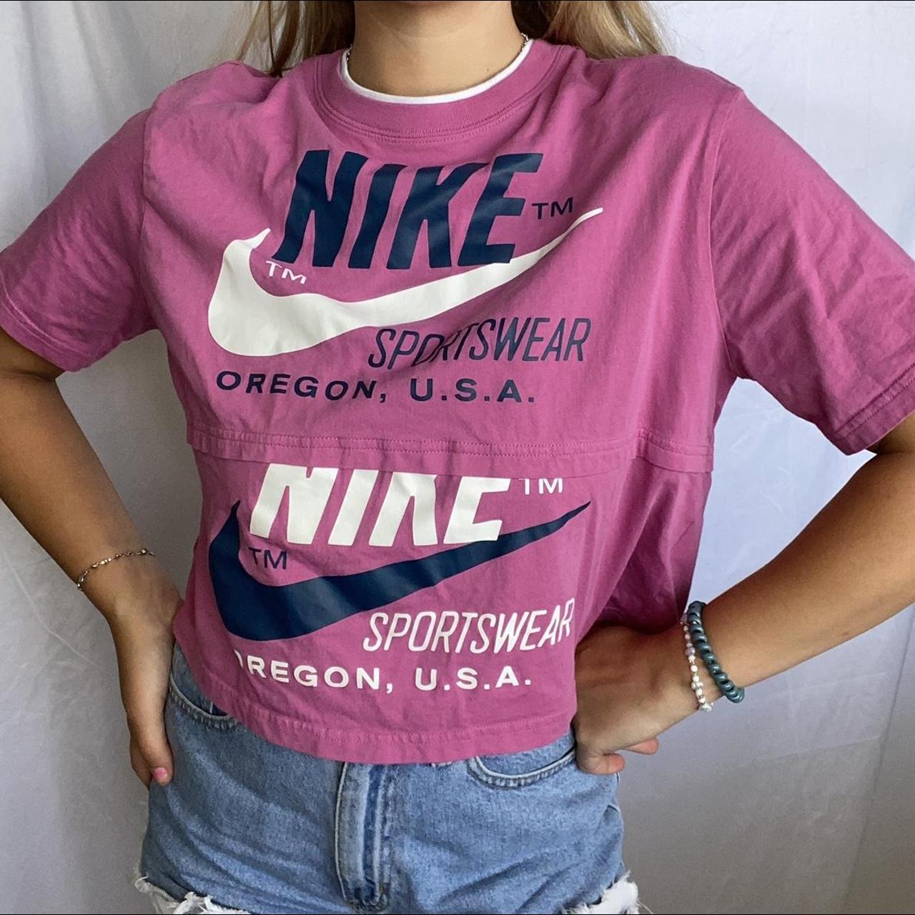pink black and white nike shirt