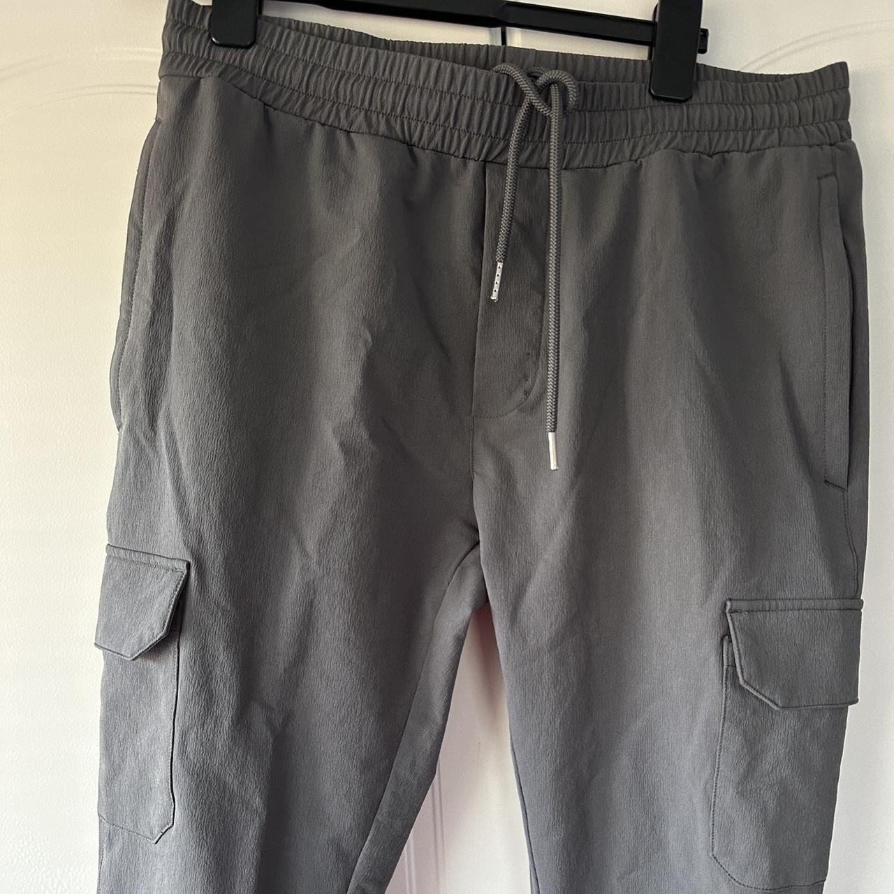 Arne cargo pant Good condition Zips at both ankles... - Depop