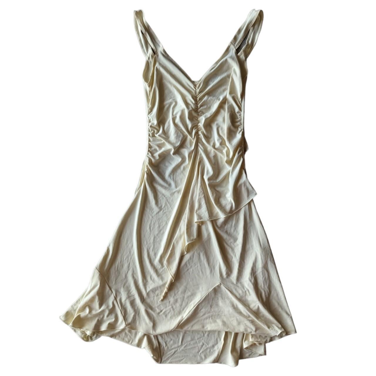 Vintage early 2000s cream ruffled mini dress with an... - Depop