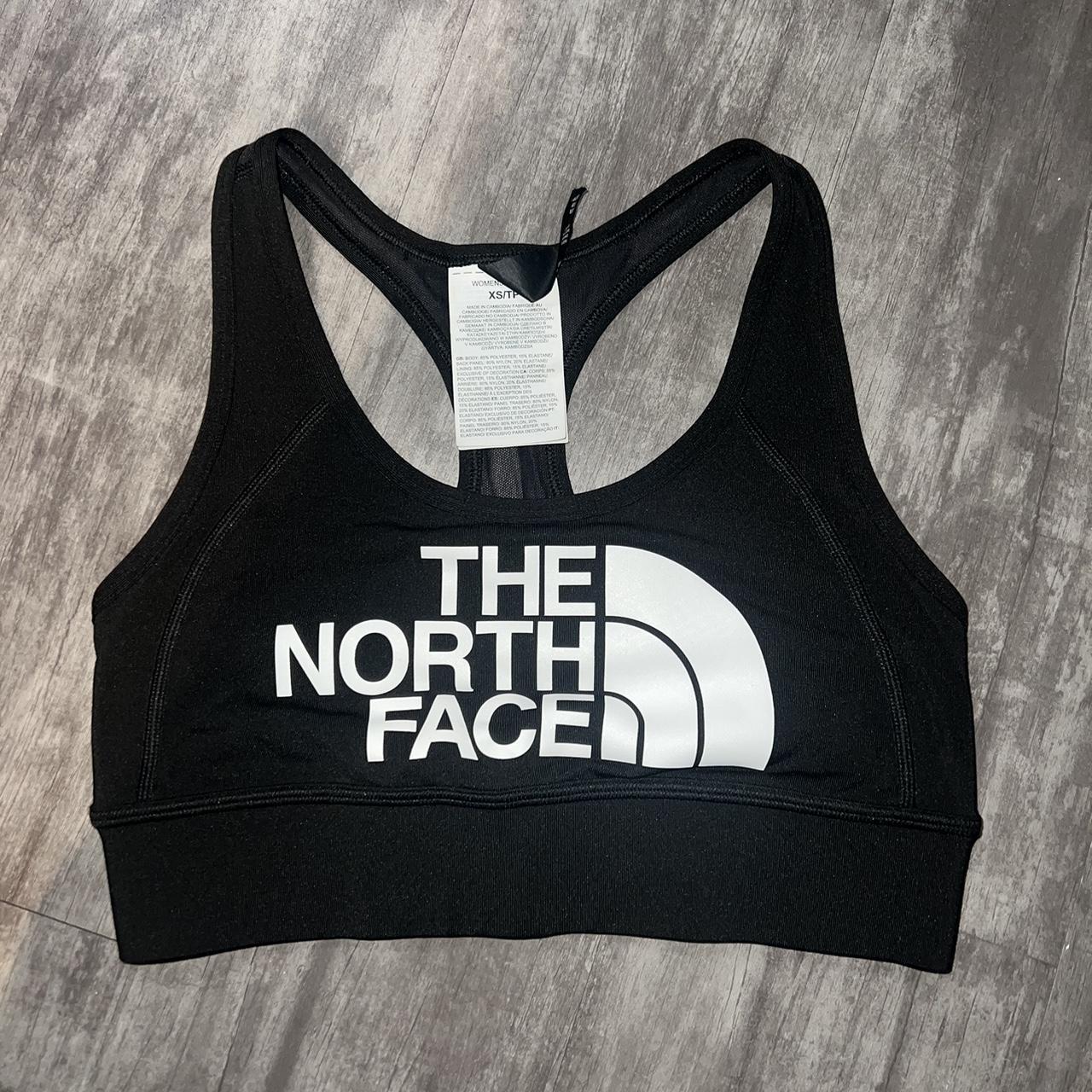 The North Face logo-band Sports Bra - Farfetch