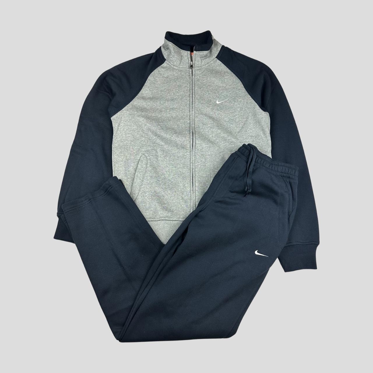 grey and blue nike tracksuit