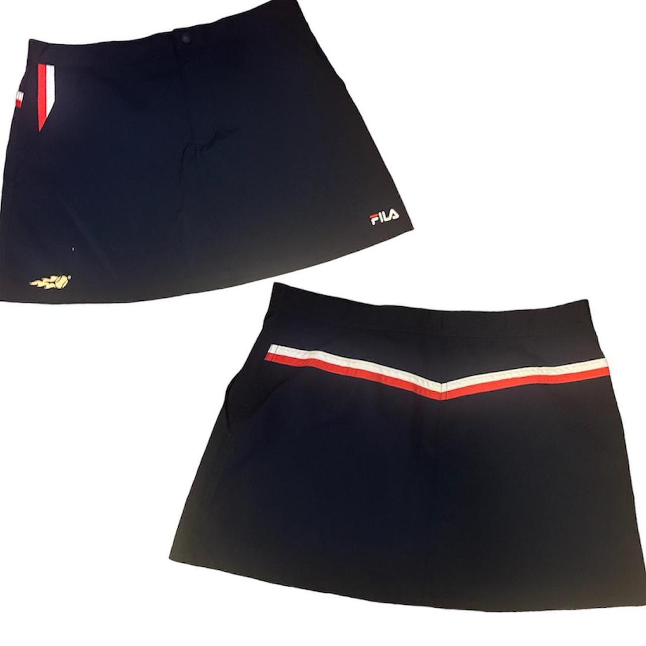 Navy blue Fila athletic skirt labeled a size... Depop