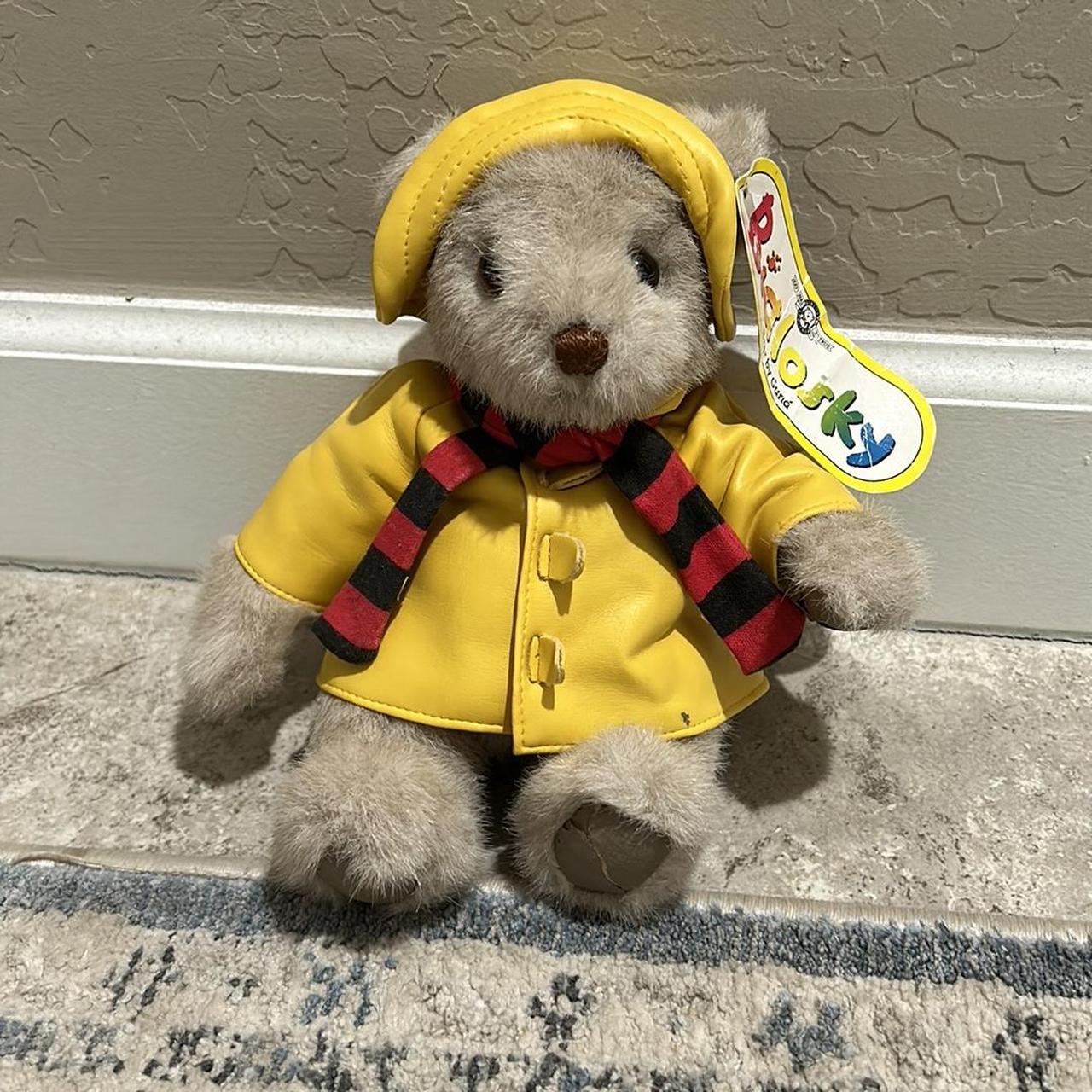 Teddy bear store with yellow raincoat